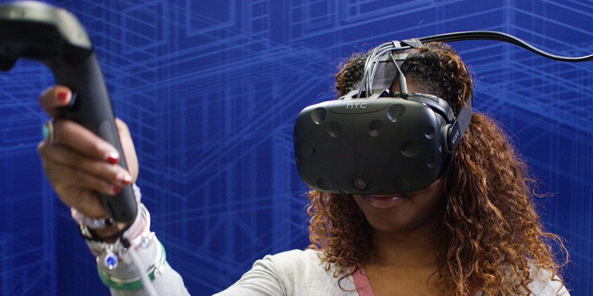 African-American woman wearing VR headset learning DIY skills in a Lowes Home Improvement holoroom