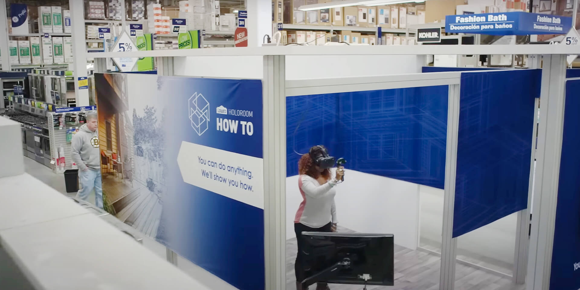 African-American woman wearing VR headset in Lowes Home Improvement holoroom learning DIY skills